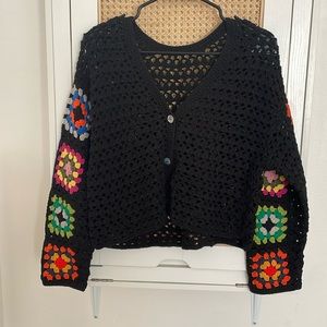 Crocheted cardigan with floral details